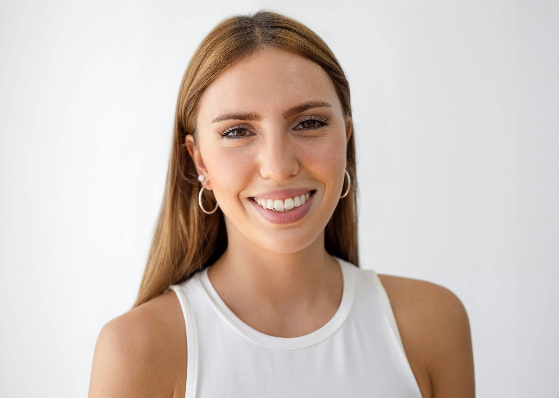 Woman in white shirt smiling