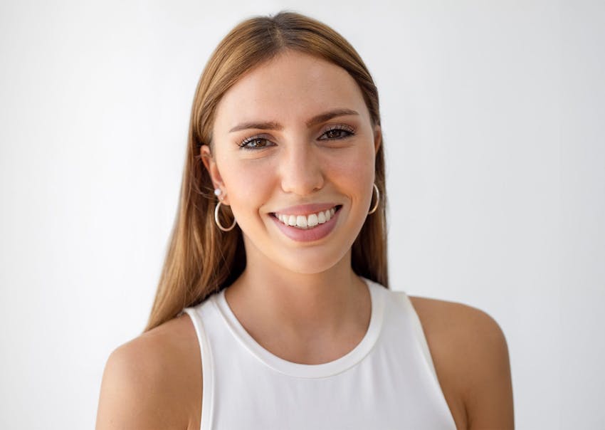 Woman in white shirt smiling