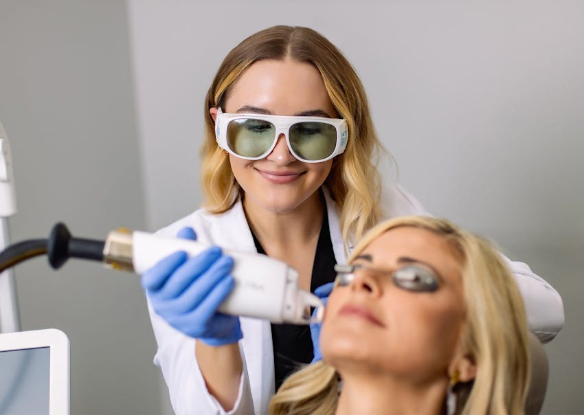 woman getting a face treatment done