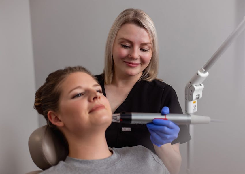 Woman receiving RF Microneedling