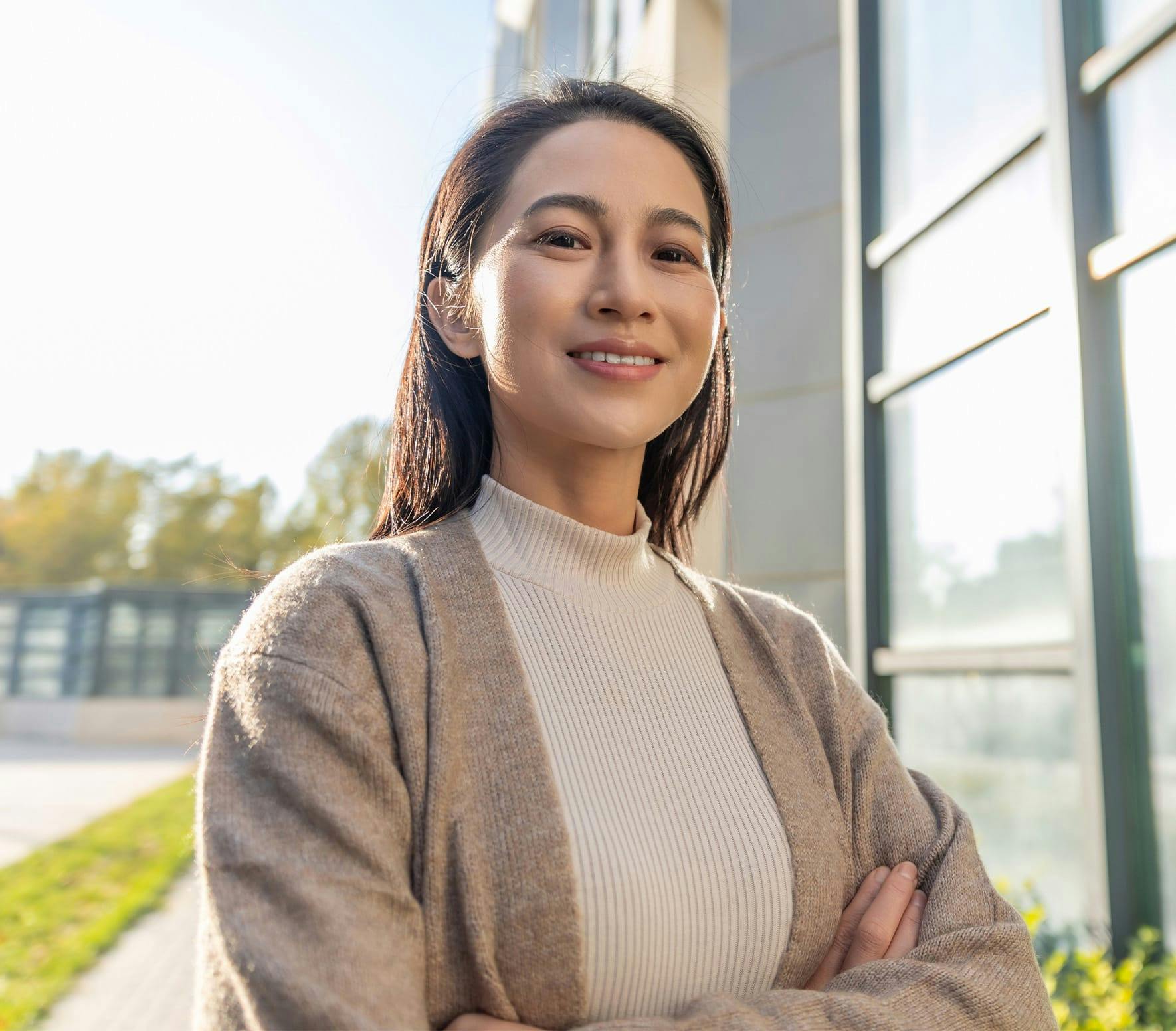 Woman in tan sweater