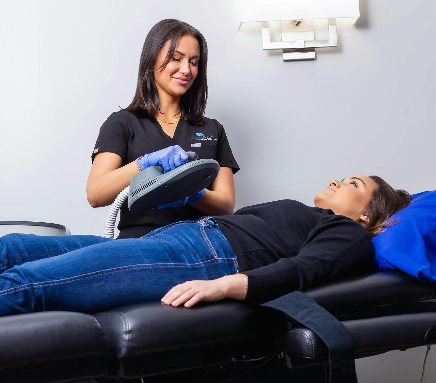 woman getting an emsculpt neo procedure