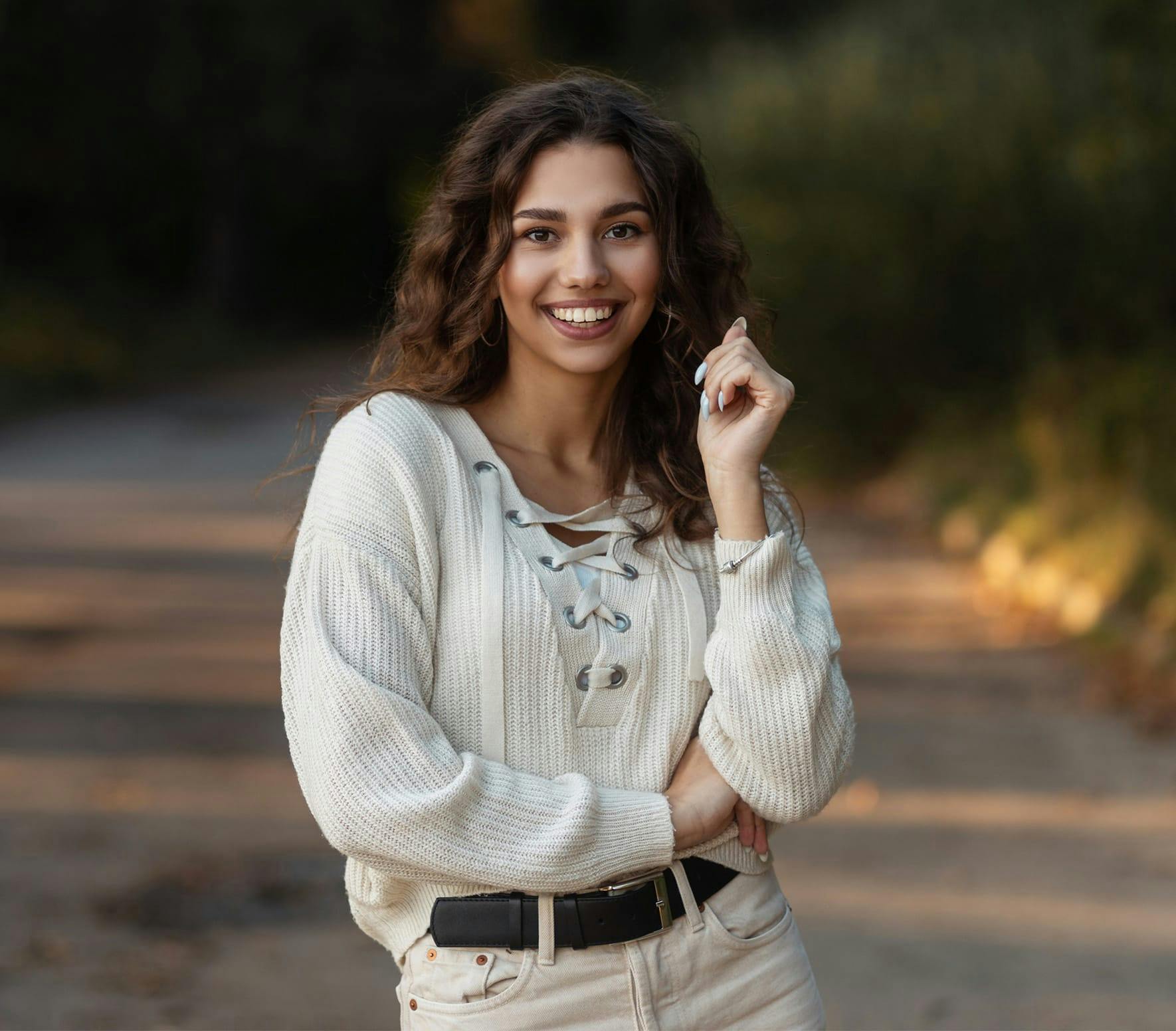 smiling woman standing outside