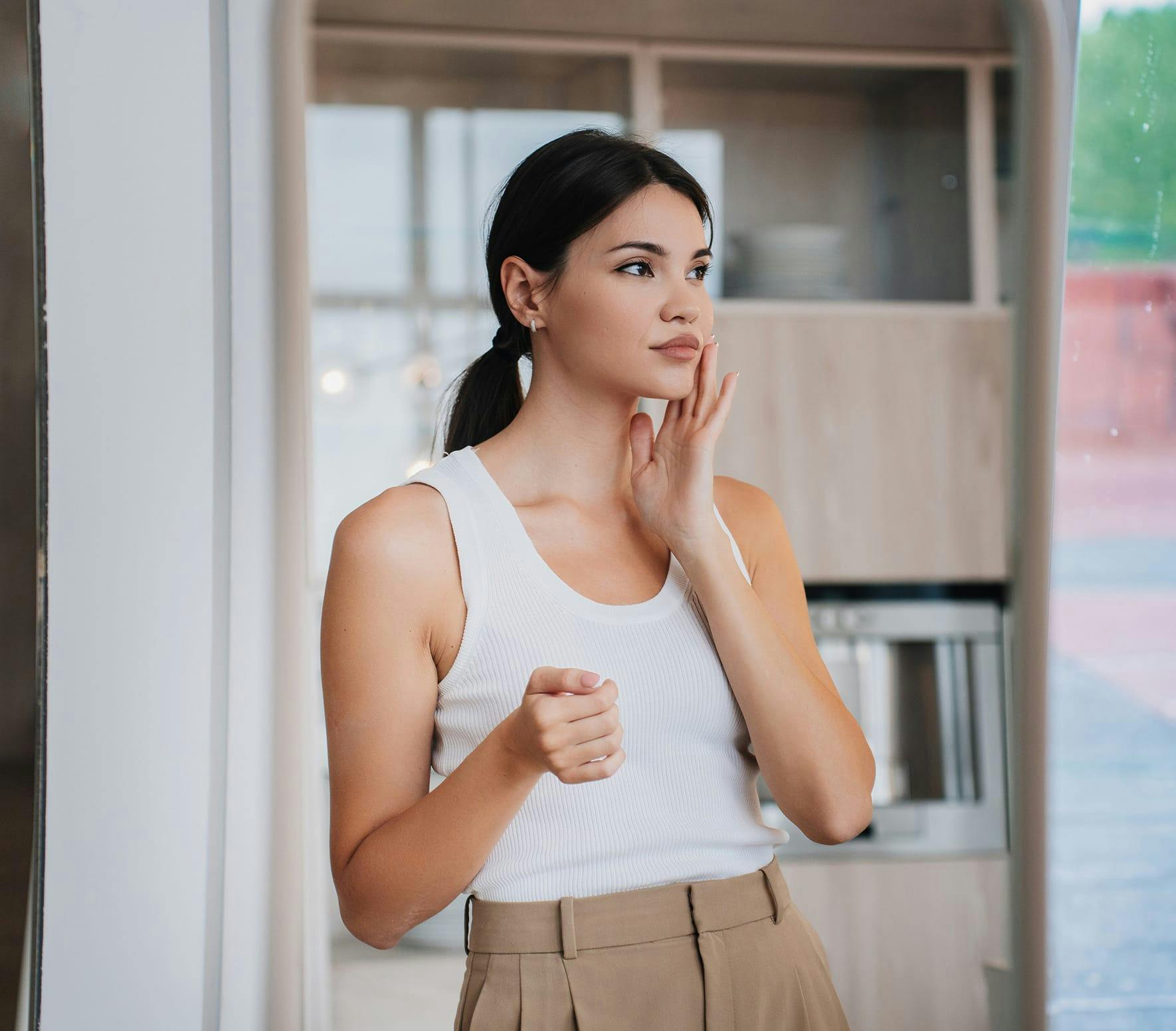 Woman feeling face
