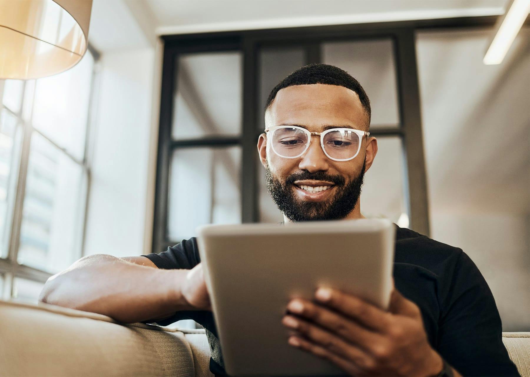 Man reading on iPad