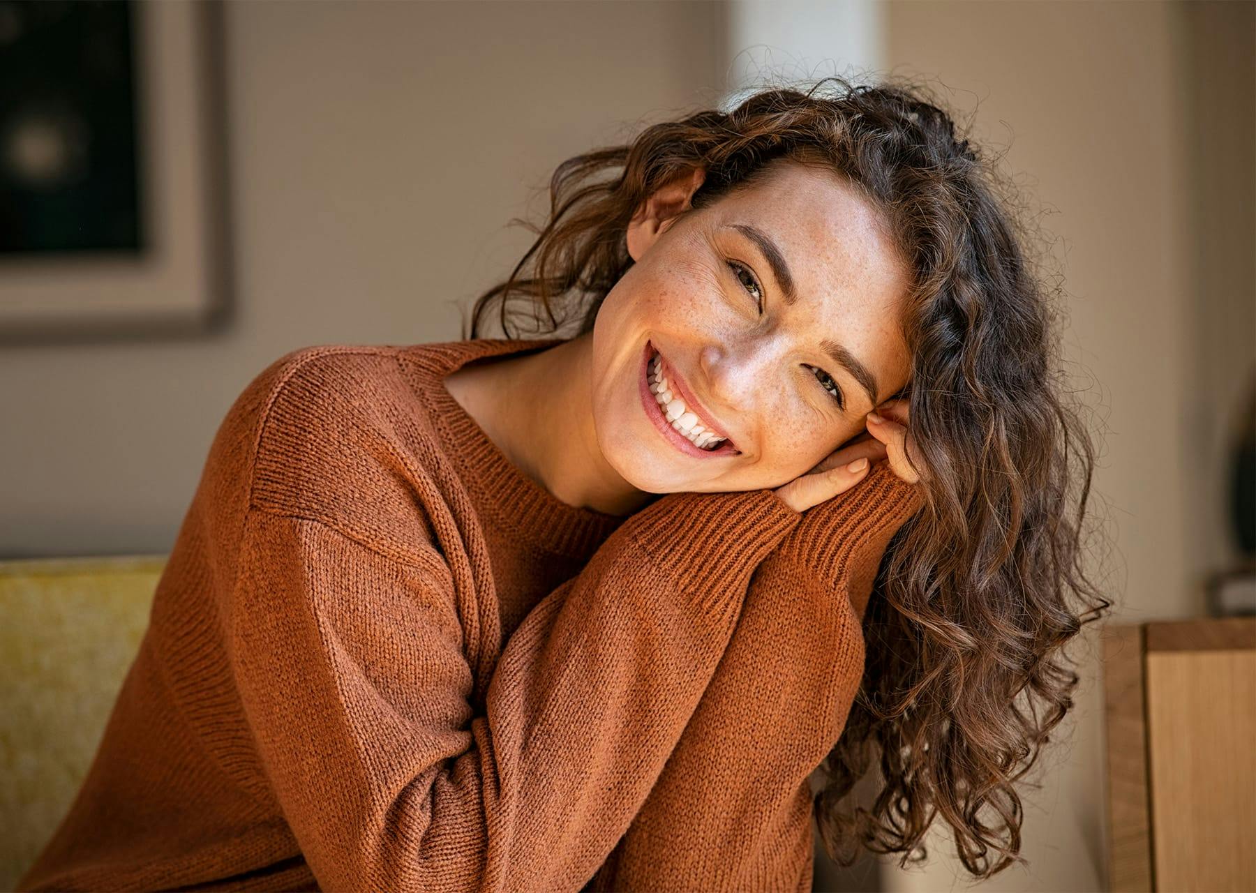 Freckled woman smiling