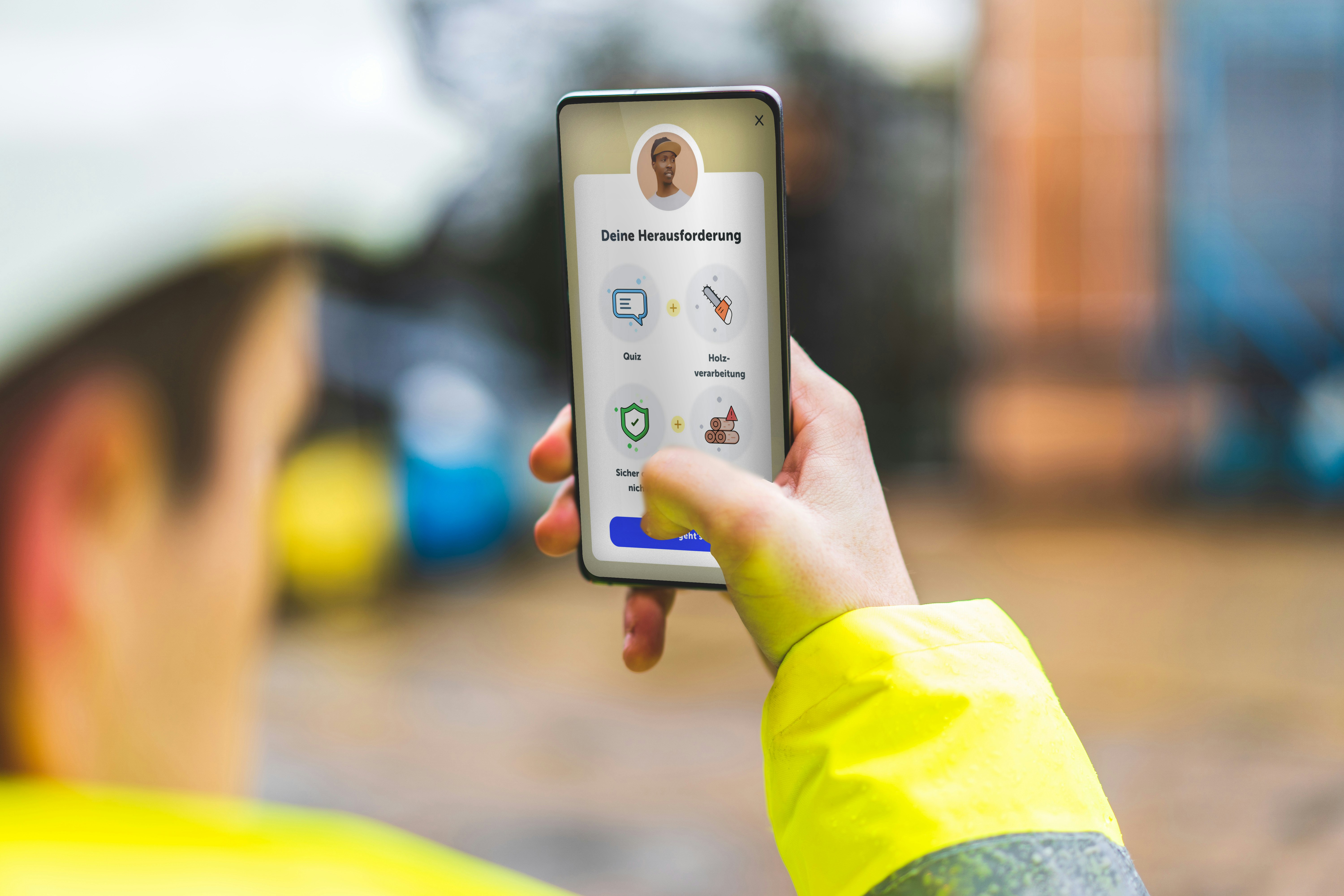 Person in a yellow jacket using a smartphone app with icons for quiz, media, and safety features, in an outdoor setting.