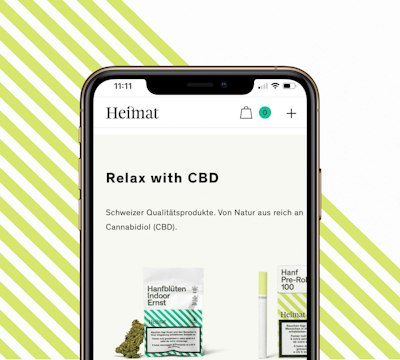 Smartphone displaying a website for CBD products, featuring text "Relax with CBD" and images of packaged items. Background includes diagonal green and white stripes.