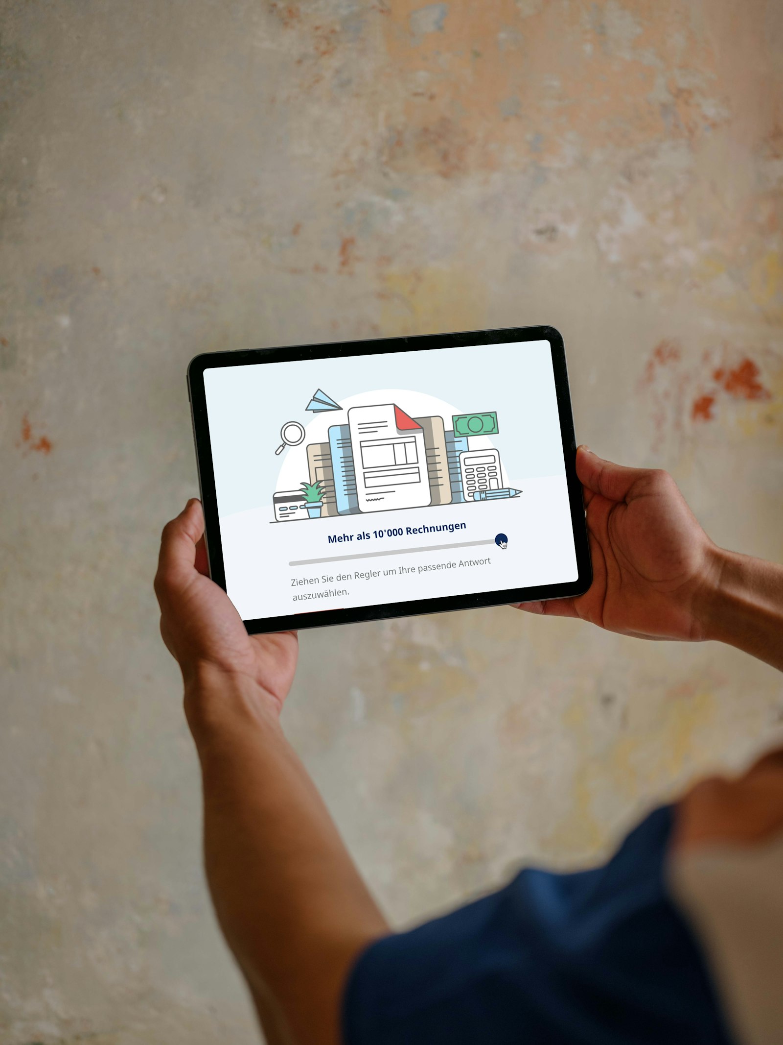 Person holding a tablet displaying an illustration of paperwork, graphs, and currency with text in German.