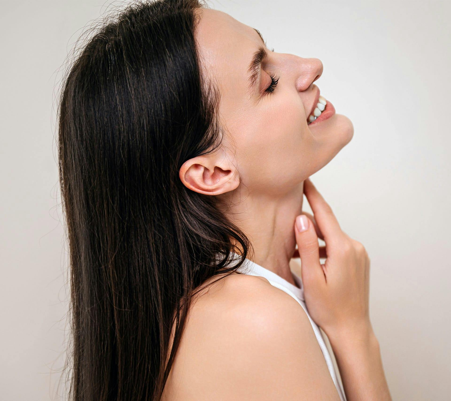 side profile of woman smiling