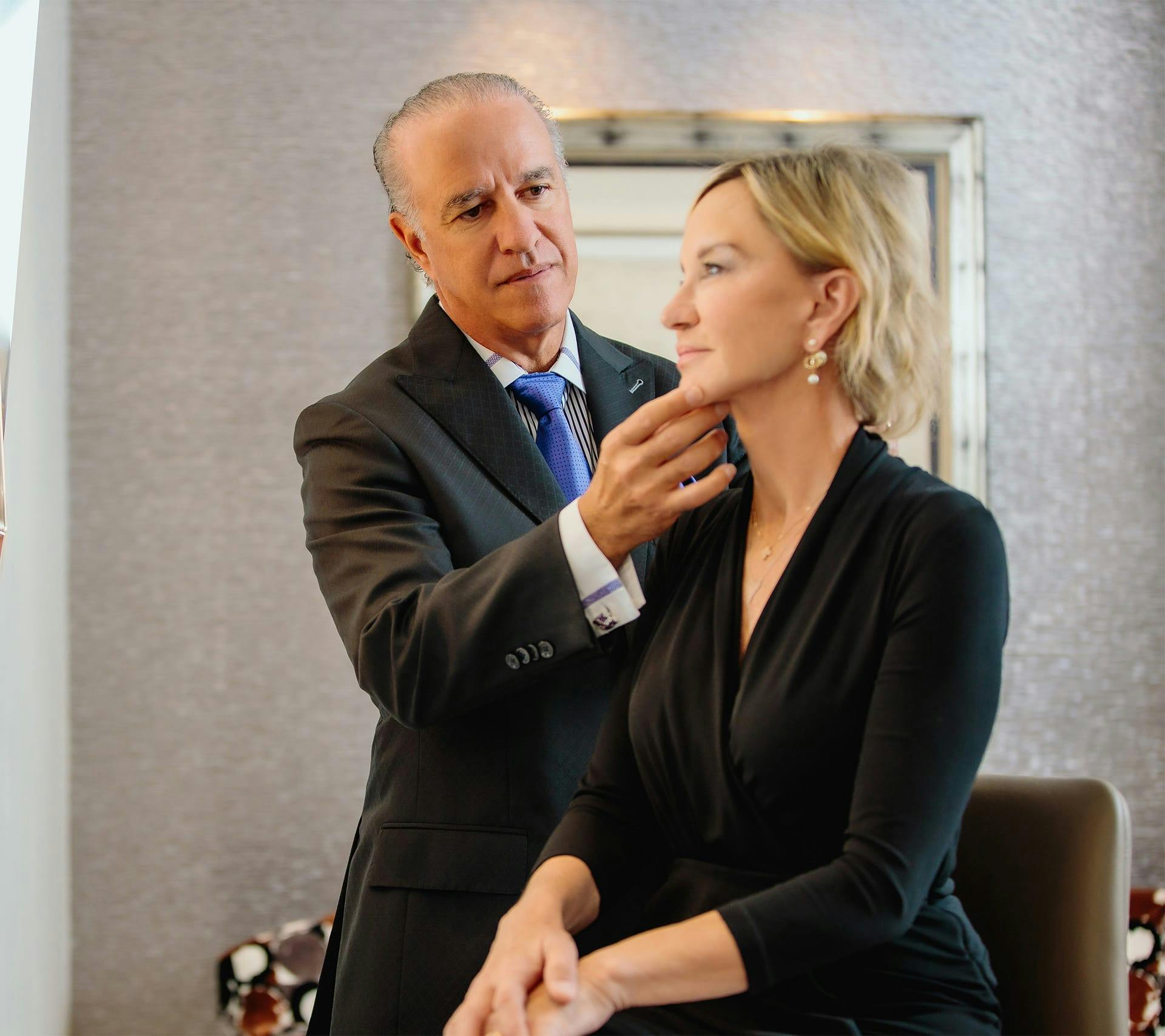 doctor touching womans face