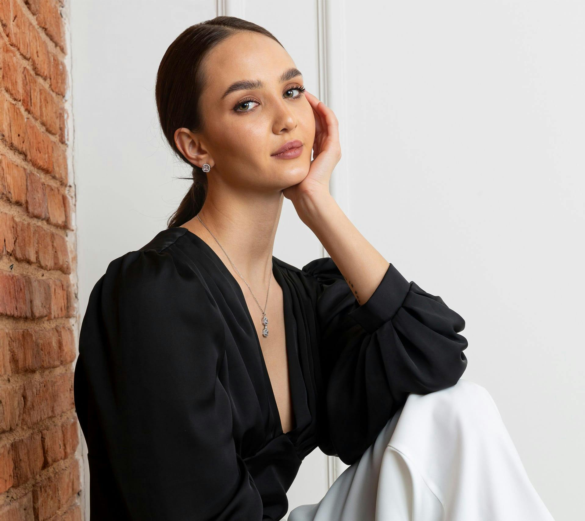 young woman touching face