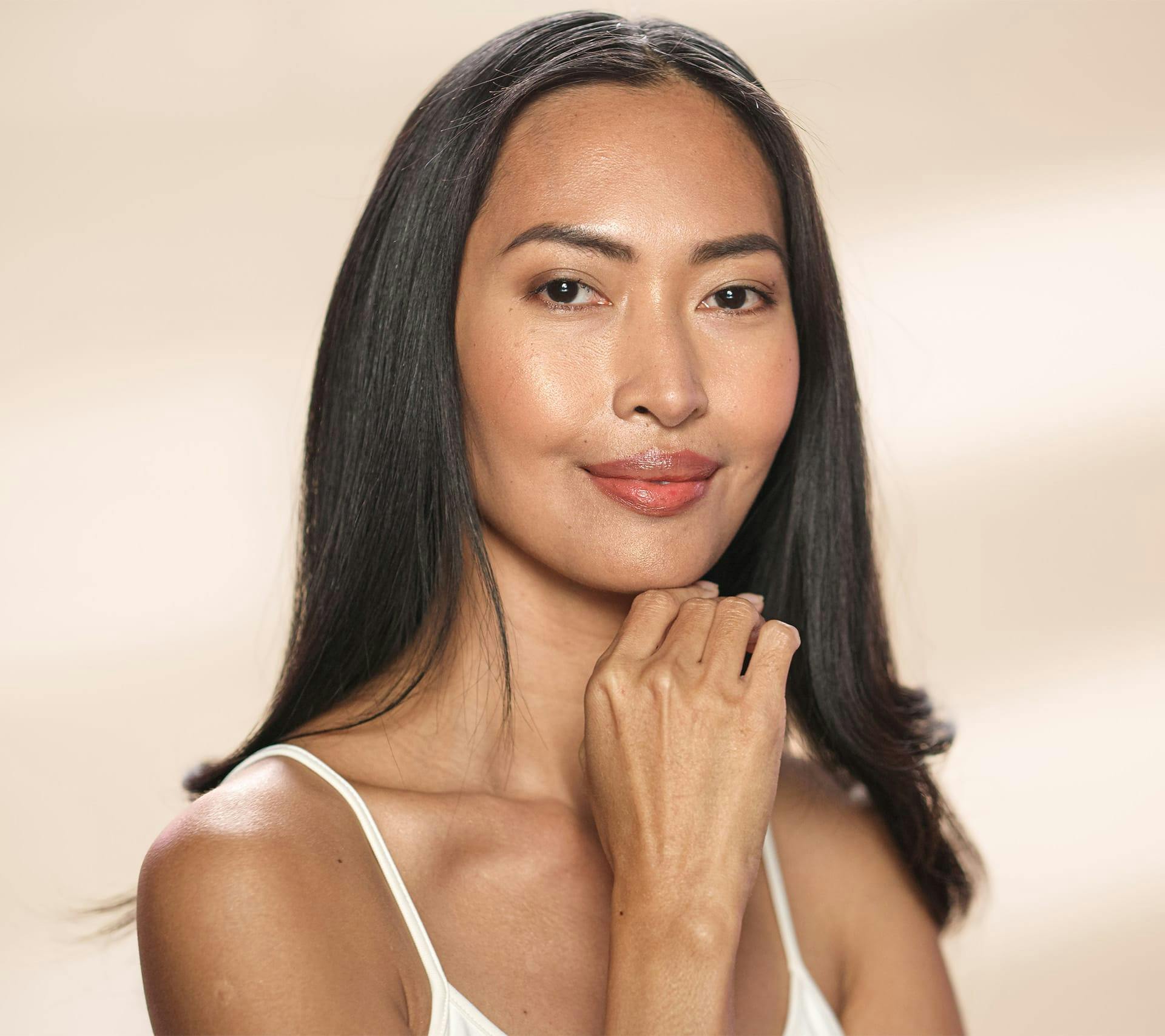 young woman touching face