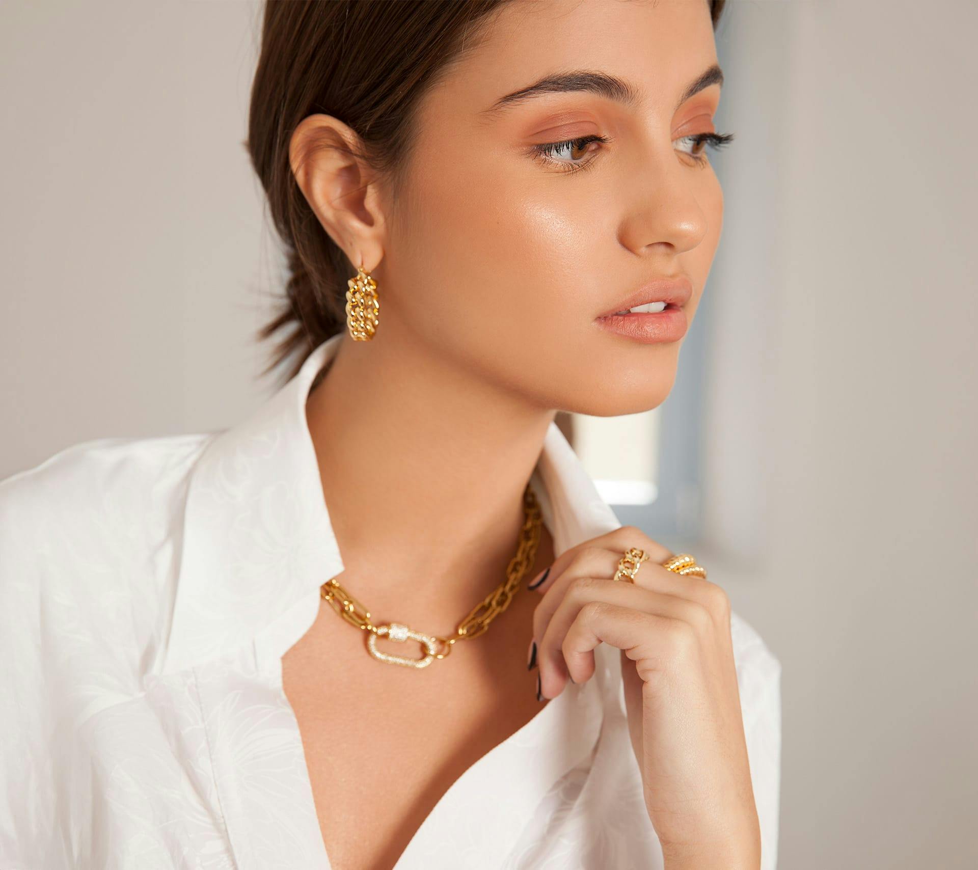 young woman touching shirt