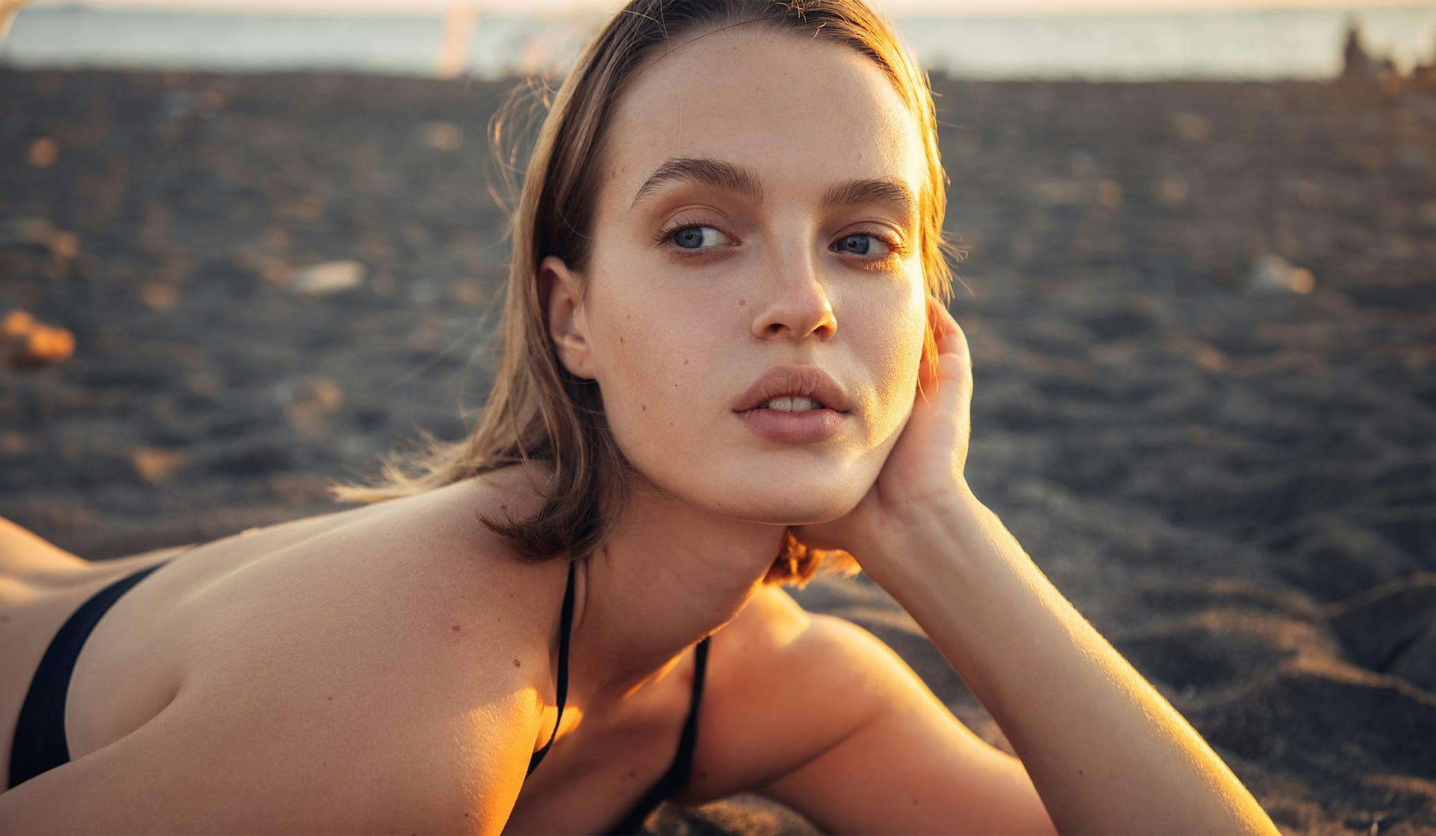 woman laying on the beach