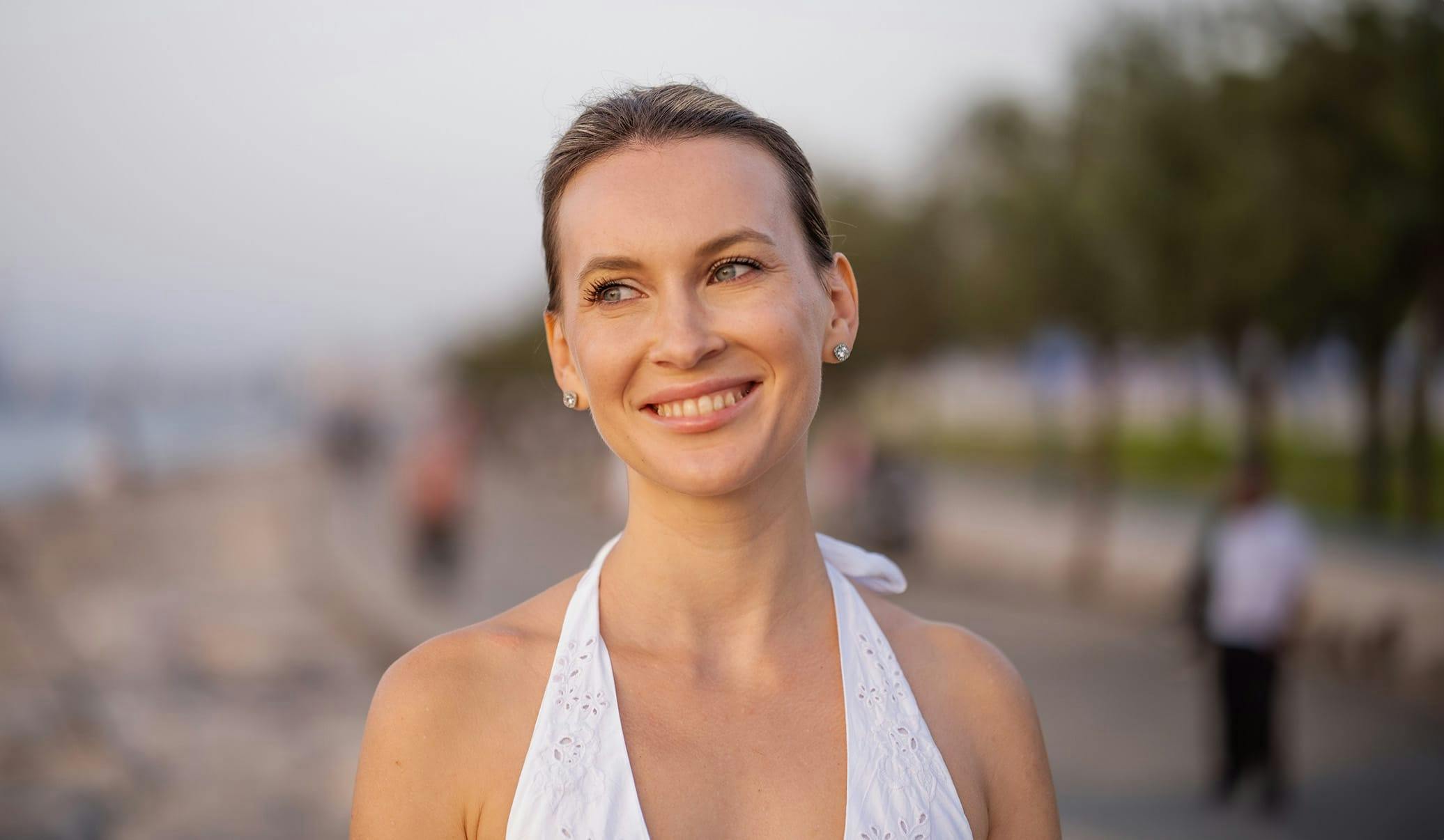 woman wearing a white halter top