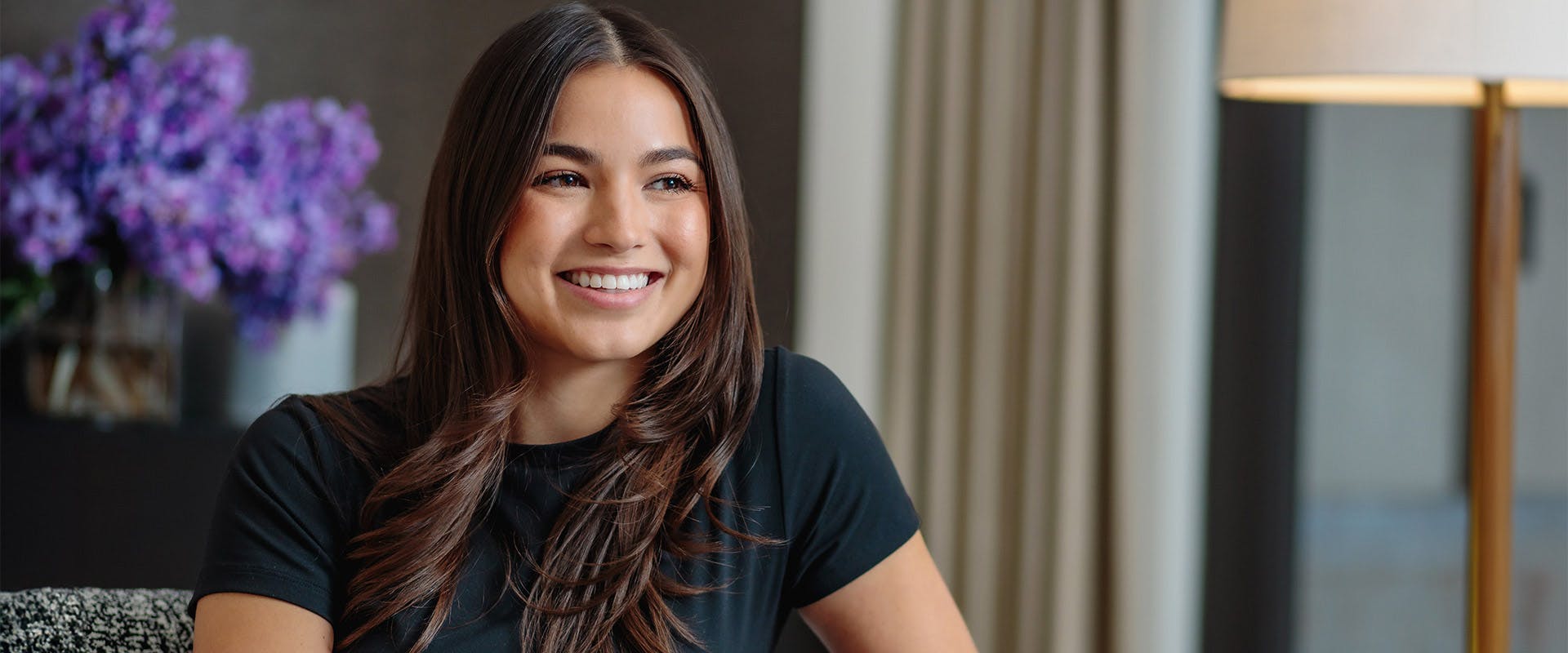 woman with long brown hair smiling