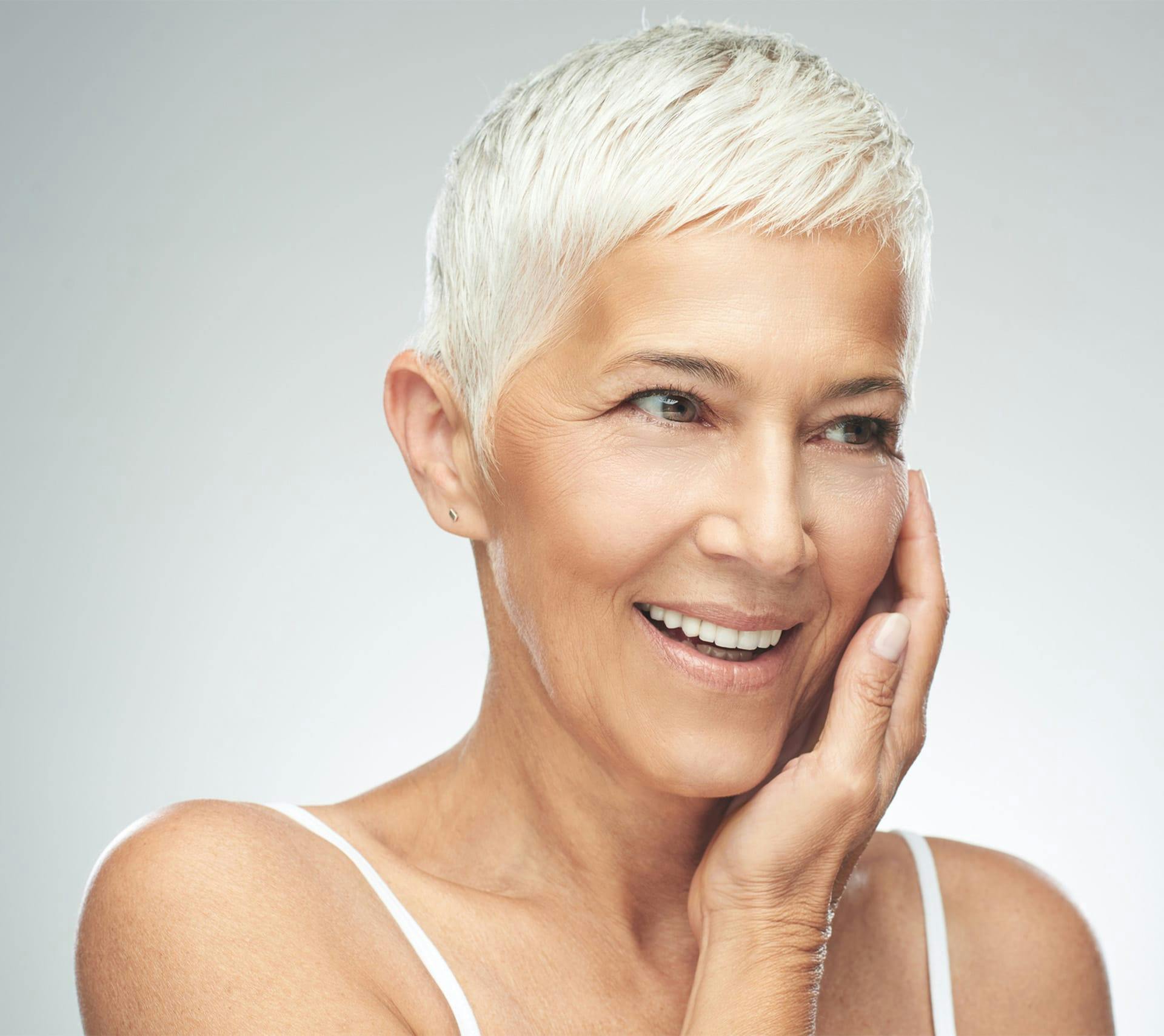 older woman with very short grey hair