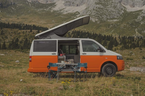 Side view of VW T5 from Balkan Campers with a pop top roof in Vršič mountain pass, Slovenia