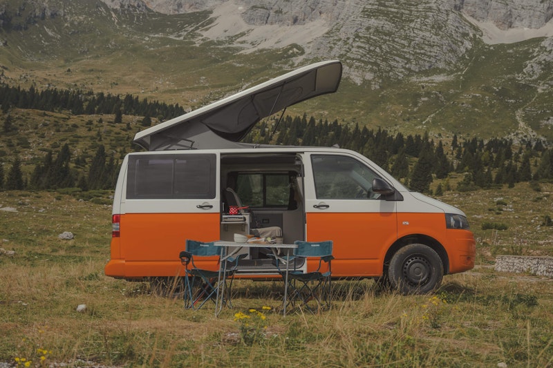 Side view of VW T5 from Balkan Campers with a pop top roof in Vršič mountain pass, Slovenia