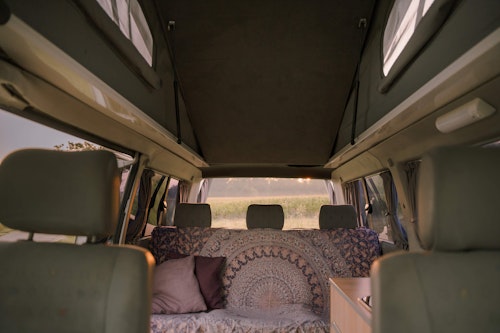 View of rear seats and pop top roof of  VW T4 Campervan