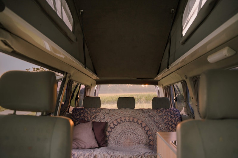 View of rear seats and pop top roof of  VW T4 Campervan