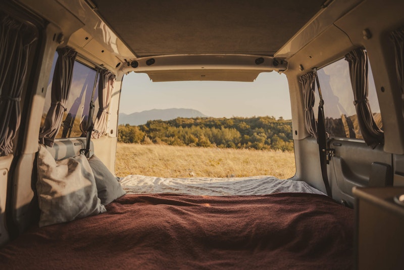Downstairs bedroom inside a VW T4 from Balkan Campers with a pop top roof in Ljubljana, Slovenia