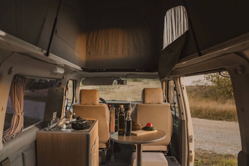 Living space inside a VW T4 from Balkan Campers with a pop top roof in Ljubljana, Slovenia