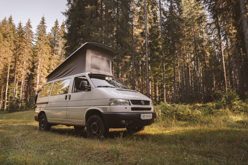 VW T4 with a pop top roof and 4WD from Balkan Campers in Slovenian forest