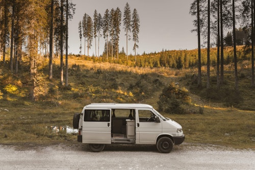 Side view of VW T4 with a pop top roof and 4WD in Triglav National Park in Slovenia