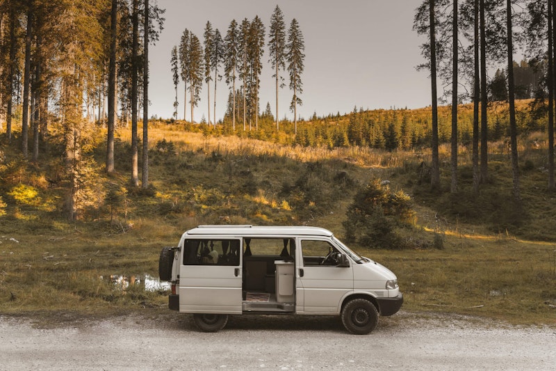 Side view of VW T4 with a pop top roof and 4WD in Triglav National Park in Slovenia