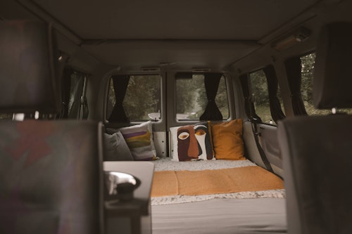 The view of lower bedroom in VW T4 with a pop top roof and 4WD in Bovec, Slovenia