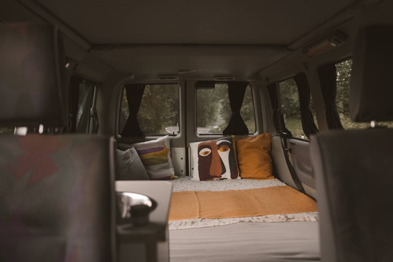 The view of lower bedroom in VW T4 with a pop top roof and 4WD in Bovec, Slovenia