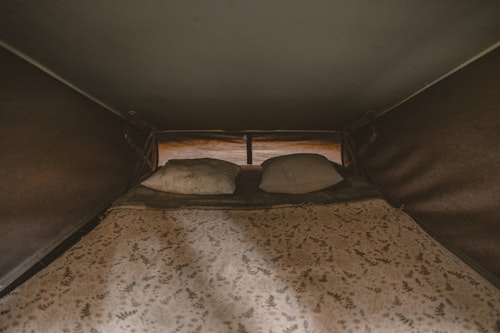 Upstairs bedroom in pop top roof in VW T4 from Balkan Campers in Slovenia