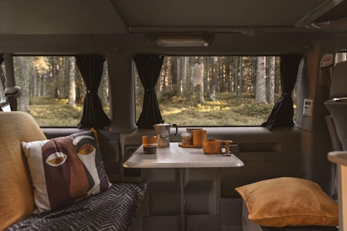 Living space in  VW T4 with a pop top roof and 4WD in Slovenian forest