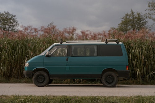 VW T4 campervan from Balkan Campers with a pop top roof and 4 WD