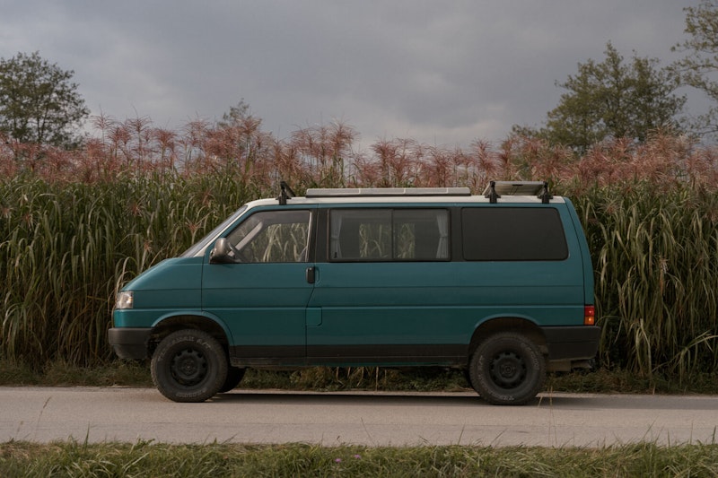 VW T4 campervan from Balkan Campers with a pop top roof and 4 WD