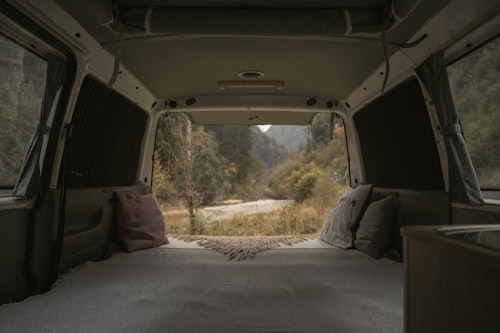Double bed in VW T4 campervan from Balkan Campers with 4 wheel drive in Karavanke Mountains, Slovenia