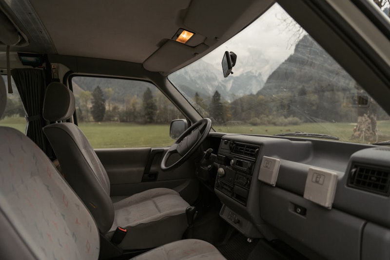 Dashboard inside VW T4 from Balkan Campers with a pop top roof in Karavanke mountains, Slovenia