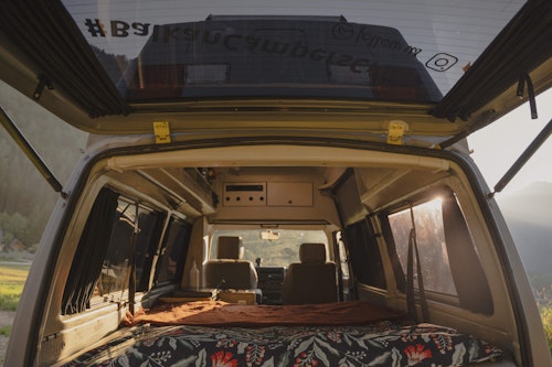 Double bed in VW T4 campervan from Balkan Campers with hard roof top and 4 wheel drive