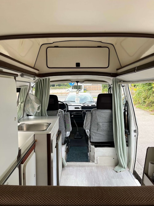 Inside space of VW T3 from Balkan Campers with hard roof top and standing height