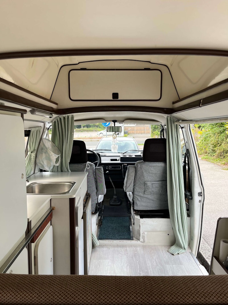 Inside space of VW T3 from Balkan Campers with hard roof top and standing height