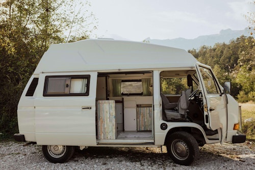 Side view of VW T3 from Balkan Campers next to Soča river, Slovenia