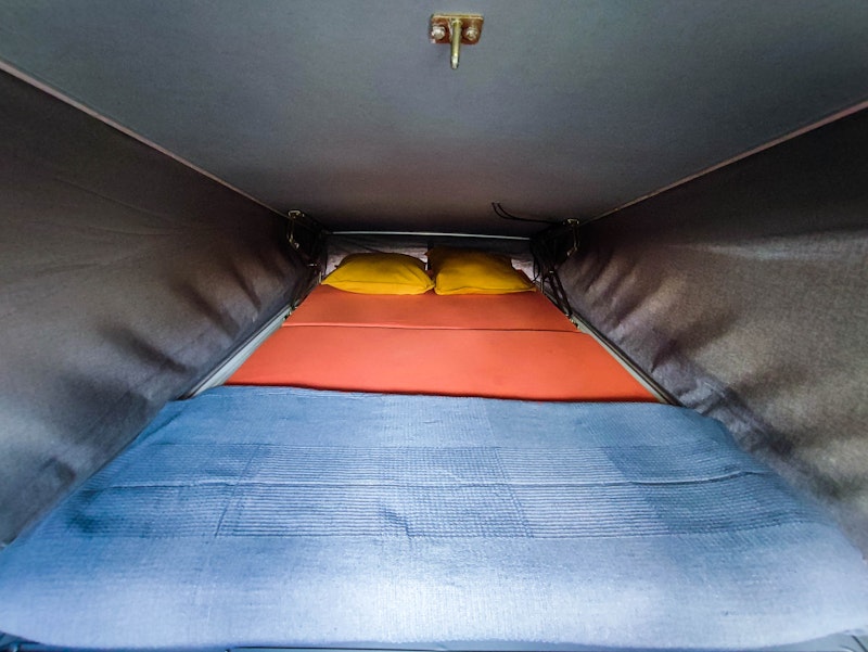 Upper bedroom in VW T4 Campervan Original Westfalia with pop top roof from Balkan Campers in Kobarid, Slovenia