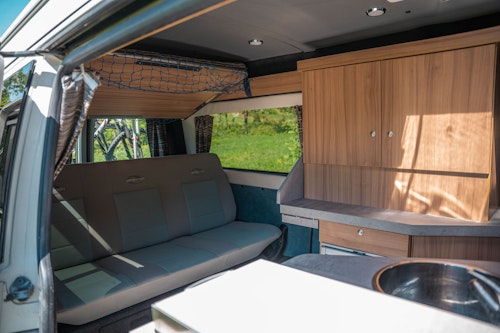 Interior of VW T5 Campervan with hard roof top from Balkan Campers in Ljubljana, Slovenia