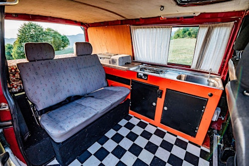 Living space in VW T4 Campervan with roof tent from Balkan Campers in Tolmin, Slovenia