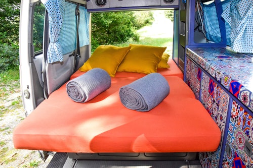 Lower bedroom in VW T4 Campervan Original Westfalia with pop top roof from Balkan Campers in Kobarid, Slovenia
