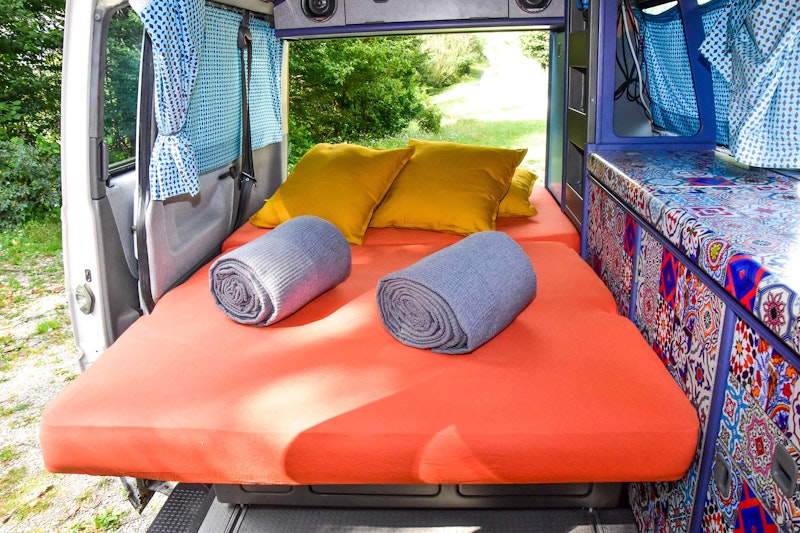 Lower bedroom in VW T4 Campervan Original Westfalia with pop top roof from Balkan Campers in Kobarid, Slovenia