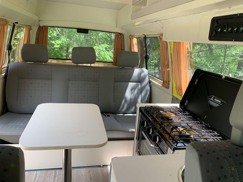 Living room in VW T4 Campervan with 4WD and high roof top from Balkan Campers in Logar Valley, Slovenia