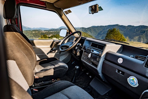 Front seats in VW T4 Campervan with roof tent from Balkan Campers in Tolmin, Slovenia